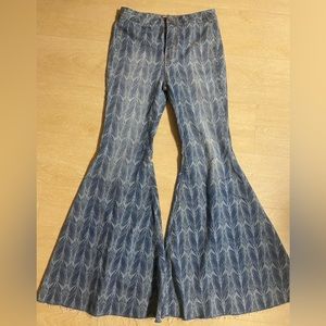 we the free bell bottom stretch denim jeans. Beautiful feather, print.
